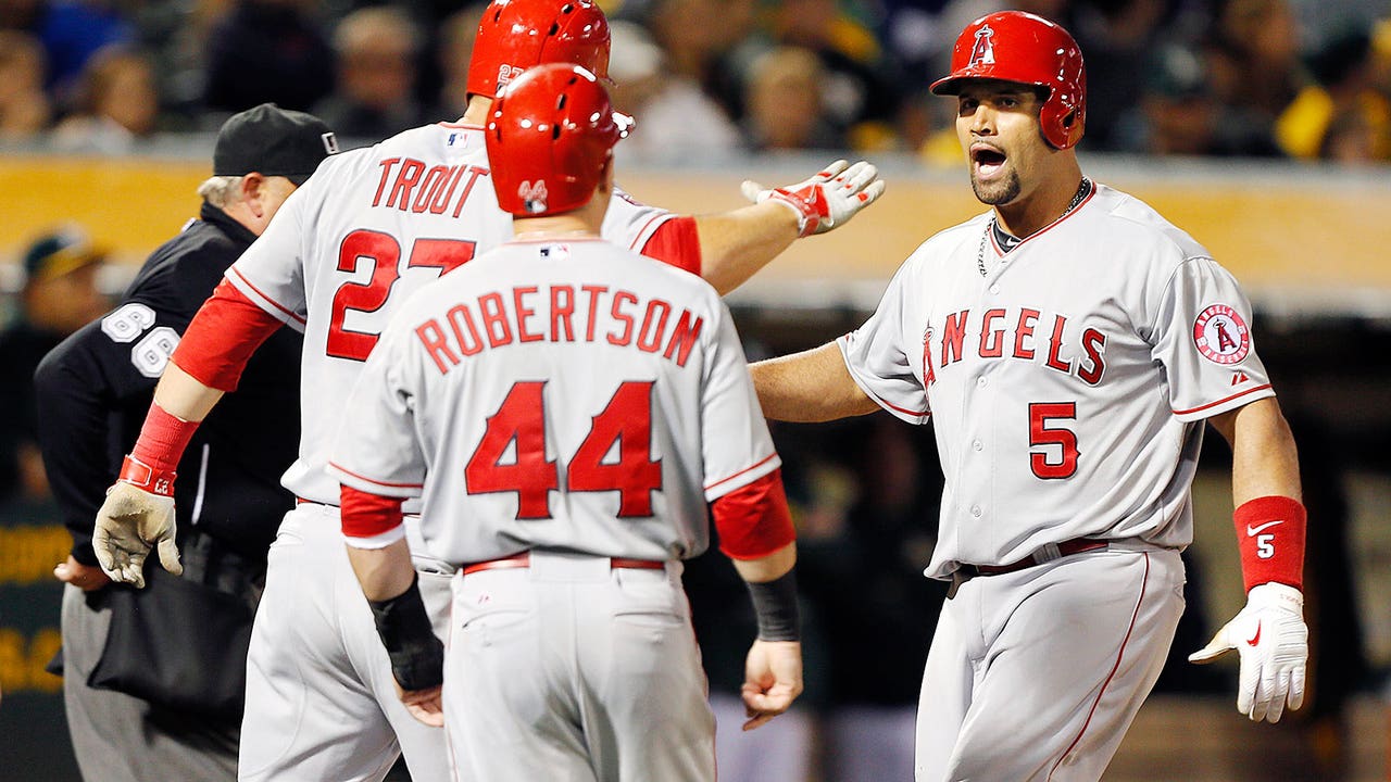 Pujols hits slam, drives in 5 runs to rally Angels past Athletics